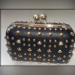 Black purse with gold studs